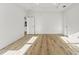 Spacious bedroom with tray ceiling, wood floors, and a closet, creating a bright and airy atmosphere at 8906 N Otis Ave, Tampa, FL 33604