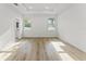 Bright main bedroom with neutral walls, a walk-in closet, and natural light at 8906 N Otis Ave, Tampa, FL 33604