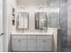 Beautiful bathroom with double sinks, modern fixtures, and glass walk-in shower at 9503 W. Park Village Dr, Tampa, FL 33626