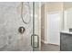 Close up of walk-in shower with glass door, and modern fixtures in bathroom at 9503 W. Park Village Dr, Tampa, FL 33626