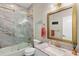 Bathroom featuring marble surround shower over tub, gold hardware, and granite countertop sink at 9503 W. Park Village Dr, Tampa, FL 33626