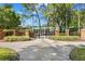 Baybridge Park entrance with brick pillars and manicured landscaping for relaxing community activities at 9503 W. Park Village Dr, Tampa, FL 33626