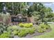 Welcoming Westchase community sign surrounded by lush landscaping and trees at 9503 W. Park Village Dr, Tampa, FL 33626