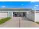 A well-kept exterior of the two-car garage with an open door and concrete driveway at 9503 W. Park Village Dr, Tampa, FL 33626