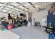 A spacious two car garage with white epoxy floors and organized storage at 9503 W. Park Village Dr, Tampa, FL 33626
