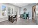 Kitchenette with a small table, chairs, bright windows, wine cooler, and tiled floors at 9503 W. Park Village Dr, Tampa, FL 33626