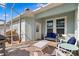 Covered lanai with brick pavers, outdoor seating, and view of the yard at 9503 W. Park Village Dr, Tampa, FL 33626
