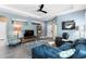 Cozy living room featuring a modern blue sofa, stylish accents, and an open layout, perfect for relaxation at 9503 W. Park Village Dr, Tampa, FL 33626