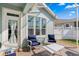 Relaxing screened-in patio area featuring comfortable seating and a stylish brick paver floor at 9503 W. Park Village Dr, Tampa, FL 33626