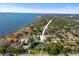 Aerial view showing the property location in a neighborhood with mature trees, near the coast at 1039 Union St, Clearwater, FL 33755