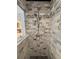 Stunning walk-in shower with gray and white tile, decorative border, and dual shower heads at 1039 Union St, Clearwater, FL 33755