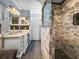 Bathroom featuring a large glass shower with custom tile work and double vanity at 1039 Union St, Clearwater, FL 33755