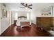 Primary bedroom features hardwood floors, a ceiling fan, and ensuite bathroom at 1039 Union St, Clearwater, FL 33755