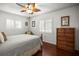 Well-lit bedroom highlighting wood floors, plantation shutters, and ample closet space at 1039 Union St, Clearwater, FL 33755