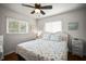 Cozy bedroom with a beach-themed quilt, white wicker headboard, and serene nautical decor at 1039 Union St, Clearwater, FL 33755