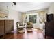 Bedroom features hardwood floors, a seating area, and bright natural light at 1039 Union St, Clearwater, FL 33755
