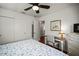 Comfortable bedroom featuring a ceiling fan, and an art-adorned desk area at 1039 Union St, Clearwater, FL 33755