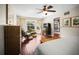 Bedroom features hardwood floors, seating area, and a ceiling fan at 1039 Union St, Clearwater, FL 33755