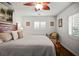 Inviting bedroom with a queen-sized bed, beautiful wood floors, and charming details at 1039 Union St, Clearwater, FL 33755