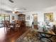 Dining room showcasing wood floors, a ceiling fan, hutch, and furniture set with access to living room and lanai at 1039 Union St, Clearwater, FL 33755