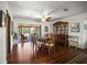 Formal dining room with hardwood floors, wooden furniture set, and screened-in porch access at 1039 Union St, Clearwater, FL 33755