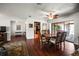 Dining room featuring wood floors, ceiling fan, set with seating for six, and access to lanai and living spaces at 1039 Union St, Clearwater, FL 33755