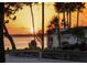 Waterfront neighborhood with a welcome sign at sunset, showcasing the home's idyllic setting at 1039 Union St, Clearwater, FL 33755
