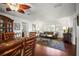 Open-concept living room with hardwood floors, and access to dining room with a glimpse into the front entry at 1039 Union St, Clearwater, FL 33755