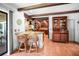 Open living space with beamed ceilings, bar seating, and screened-in porch access at 1039 Union St, Clearwater, FL 33755