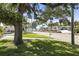 Charming neighborhood street scene with well-maintained lawns and mature trees near the water at 1039 Union St, Clearwater, FL 33755