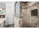 Custom tiled shower featuring decorative tile and glass door at 1039 Union St, Clearwater, FL 33755