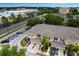 Aerial view of townhomes showing roof lines, parking, and community amenities at 1051 Andrew Aviles Cir, Tampa, FL 33619