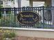 A view of the Alexandria Place Townhomes community sign on a black, gold-trimmed sign at 1051 Andrew Aviles Cir, Tampa, FL 33619