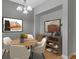 Inviting dining area featuring a round table, modern decor, and ample natural light at 1051 Andrew Aviles Cir, Tampa, FL 33619