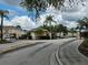 Community entrance featuring a guardhouse, gates, landscaping, and neatly paved streets at 1051 Andrew Aviles Cir, Tampa, FL 33619