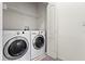 Functional laundry room equipped with a modern washer and dryer for convenient home maintenance at 1051 Andrew Aviles Cir, Tampa, FL 33619