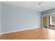 Bright, open living room with wood floors and sliding glass doors to outdoor area at 1051 Andrew Aviles Cir, Tampa, FL 33619