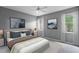 Tranquil main bedroom with large windows, soft carpet, and elegant decor, creating a serene retreat at 1051 Andrew Aviles Cir, Tampa, FL 33619
