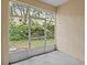 Relaxing screened patio provides an airy and bright space overlooking the backyard at 1051 Andrew Aviles Cir, Tampa, FL 33619