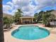 Community pool and recreation area with lounge chairs and covered seating at 1051 Andrew Aviles Cir, Tampa, FL 33619