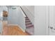 Carpeted stairway leading to the upper level, featuring neutral walls and natural light at 1051 Andrew Aviles Cir, Tampa, FL 33619