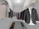 Organized walk-in closet with clothes and shoes on shelves and rods at 1051 Andrew Aviles Cir, Tampa, FL 33619