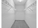 A spacious walk-in closet with carpet and wire shelving at 1051 Andrew Aviles Cir, Tampa, FL 33619