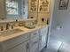 Elegant bathroom featuring double sinks, quartz countertops and ample storage for a spa-like experience at 11227 Summer Star Dr, Riverview, FL 33579
