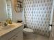 Well-lit bathroom featuring a shower/tub combo and single sink at 11227 Summer Star Dr, Riverview, FL 33579