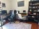 Home office with a large desk, ergonomic chairs, and built in book shelves at 11227 Summer Star Dr, Riverview, FL 33579