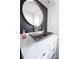 Bathroom vanity features a unique copper vessel sink, modern fixtures, and accent mirror at 1438 S Hillcrest Ave, Clearwater, FL 33756