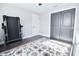 Bedroom features wood floors, a sliding door closet, and a treadmill for fitness at 1438 S Hillcrest Ave, Clearwater, FL 33756