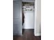 A large open closet featuring dark wood floors, and gray colored sliding doors at 1438 S Hillcrest Ave, Clearwater, FL 33756