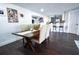 Dining area with wooden table and upholstered chairs, adjacent to the kitchen at 1438 S Hillcrest Ave, Clearwater, FL 33756